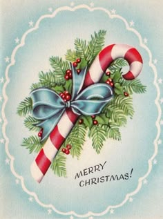 an old fashioned christmas card with candy canes and holly wreath on it's side