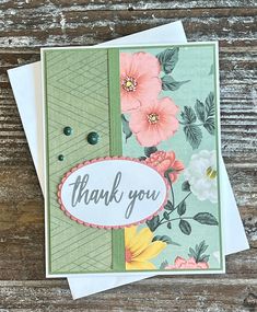 a thank you card with flowers on it