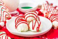 some white and red candy canes on a plate