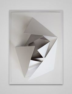 an abstract piece of art is shown in the middle of a white square with silver triangles