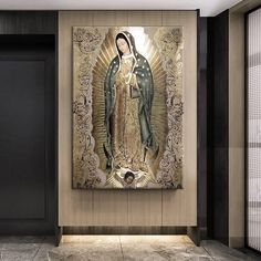 an image of the virgin mary on display in a room with black doors and marble flooring