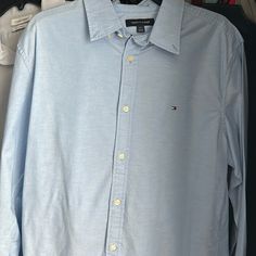 Hello, I’m Selling This Never Worn Tommy Hilfiger Shirt. It Is A Baby Blue Dress Shirt That Is Regular Fit. It Is Great For The Casual Look At Work Or Even Going Out. Tommy Dress Shirts Are Around $60. It Is Brand New. If You Are Interested Feel Free To Message Me. I’m Willing To Accept Offers As Well. Thank You! Tommy Hilfiger Cotton Button-up Shirt, Tommy Hilfiger Fitted Long Sleeve Shirt, Tommy Hilfiger Fitted Casual Shirt, Fitted Casual Tommy Hilfiger Shirt, Fitted Light Wash Collared Shirt, Fitted Long Sleeve Light Wash Shirt, Tommy Hilfiger Button-up Shirt For Spring, Fitted Blue Tommy Hilfiger Shirt, Tommy Hilfiger Classic Summer Shirt