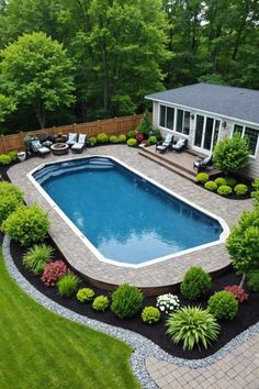 an above ground swimming pool surrounded by landscaping