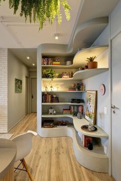 a room with some shelves and plants in it