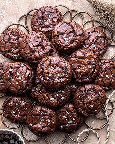 chocolate cookies with sea salt on a wire rack