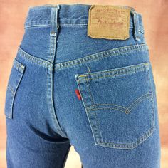 "Size 29 Vintage Levi's 501 Jeans - W29 L29 - Button Fly Jeans - Medium Wash - Classic Retro Jeans Made in USA, waist 29\" Medium Brand: LEVIS 501 Size On Tag marked W31 L32 but fits more like 29\" waist, 12\" rise, 23\" thighs, 40\" hips, 29\" inseam, 15\" leg opening! Fits a size 29, but check your measurements and compare the measurement with your garment. (see full measurement below) Recommended waist size: 29\" (29x29) *size 29 for a waist of 29 inches, expect your jeans to measure about 14.5\" across at the waist (Doubled 29\") to fit. Please follow our measurement guide: https://www.instagram.com/p/B2o273Kl5Oi/?igshid=1q5azikfj59p4 Material :  Cotton 100% Single R Red Tab Made In USA Measurements:- All measurements are taken with the garment laying flat, doubled for the Waist, hip & Levi 501 Jeans, Retro Jeans, Vintage Levis 501, 501 Jeans, Levi's 501, Levi Jeans 501, Button Fly Jeans, Levis 501, Used Clothing