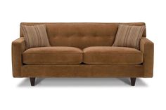 a brown couch with two pillows on it