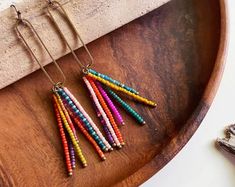 Colorful Jewelry for the Free-Spirited Art by FateandCoincidence Earrings Business, Stick Earrings, Earrings Inspiration, Rainbow Beads, Bead Work Jewelry, Rainbow Earrings, Homemade Jewelry