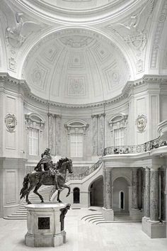 a drawing of a horse and rider in a building