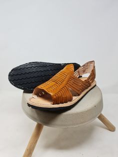 *We offer two types of shipping, one free and one accelerated. When completing your order please choose the type of shipment that suits you best Mexican Huaraches for men. These sandals are handmade by Mexican artisans in small workshops in Michoacán and Jalisco. Place your order in U.S. size and we will ship some huaraches marked in the equivalent Mexican size. For example, if you order a size 10 US we will send huaraches marked with Mexican size 8. And write to us if you have any questions, we Natural Sandals With Leather Footbed, Natural Leather Open Toe Huaraches, Artisan Natural Slip-on Huarache Sandals, Artisan Natural Huarache Slip-on Sandals, Artisan Natural Color Slip-on Huarache Sandals, Traditional Adjustable Hand-tooled Huarache Sandals, Brown Leather Huarache Sandals Vegetable-tanned, Huarache Sandals, Mens Leather Sandals