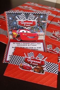 the cars birthday party table is set up with red napkins and matching place cards