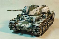 a toy tank with camouflage paint on it