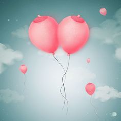 two pink balloons floating in the air