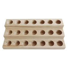 two wooden pegs with holes in them