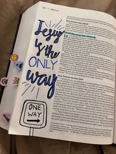 an open book with stickers on it and the words jesus is the only way