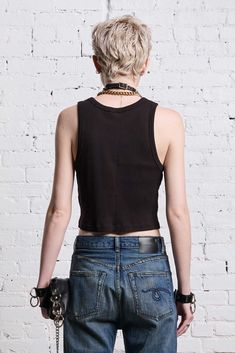 Classic tank top with distressing all throughout. Color: Black 100% Cotton R13WK080-K001A Imported Black Distressed Punk Tops, Black Ripped Punk Top, Punk Black Ripped Tops, Punk Style Black Ripped Tops, Black Sleeveless Crop Top For Streetwear, Edgy Racerback Tank Top For Spring, Edgy Black Sleeveless Crop Top, Black Sleeveless Edgy Crop Top, Urban Fitted Sleeveless Vest