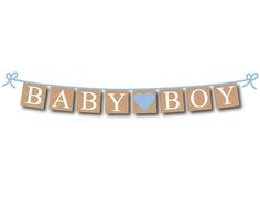 a baby boy banner with the word baby on it and a blue heart in the middle