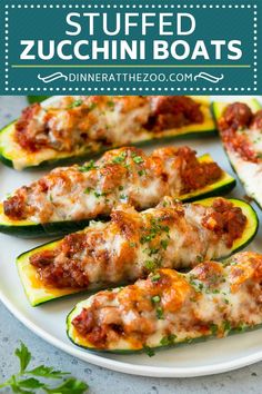 stuffed zucchini boats on a white plate