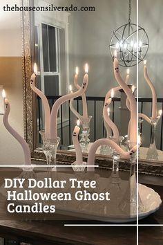 diy dollar tree halloween ghost candles in front of a mirror with text overlay that reads diy dollar tree halloween ghost candles