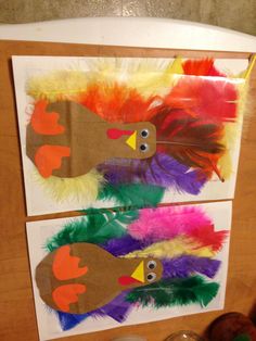 two turkeys made out of paper with feathers on them