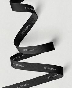 a black ribbon with the words purimma printed on it