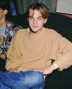 two young men sitting next to each other