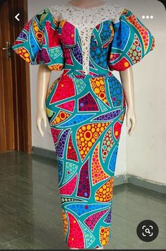 here is our Retro and unique Ankara print..Made for all event... This dress is made with 100% cotton African print. The dress is made to order so customisation is welcome.We can add or remove anything you wish.You are welcome to request a change of fabrics as well.We have lots of fabric options available. If you have any question please do feel free to start a chat. Thank you for visiting our store. Gown Ankara Styles Long, Lovely Ankara Gown Styles, Ankara Fitted Gown Styles Long, Multicolor Batik Print Dress For Party, Multicolor Batik Print Party Dress, Fitted Batik Print Dress For Party, Fitted Batik Print Party Dress, Artistic Fitted Party Dresses, Lastest Style For Ankara 2023