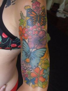 a woman with a butterfly tattoo on her arm