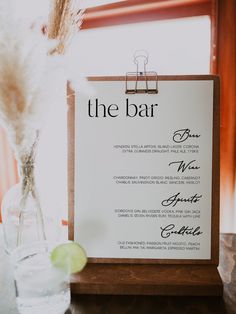 a menu card sitting on top of a wooden table