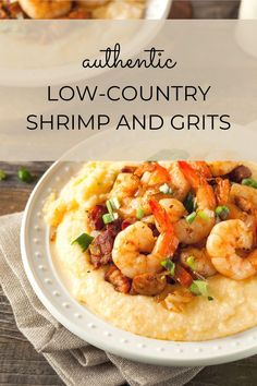 a white plate topped with grits and shrimp