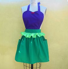 a green and purple apron on a mannequin