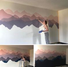 a woman painting mountains on the wall with paint rollers in her hand and another person using a brush to paint it