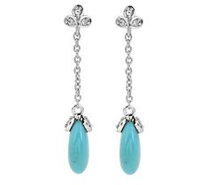 The boho-chic look of turquoise pairs effortlessly with the elegant sparkle of white topaz in these sterling silver long dangle earrings. Elegant Turquoise Earrings With Gemstone Accents, Elegant Turquoise Long Drop Jewelry, Long Dangle Earrings, White Topaz, Silver Turquoise, Turquoise Sterling Silver, Topaz, Boho Chic, Dangle Earrings