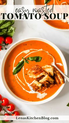 a white bowl filled with tomato soup and garnished with basil