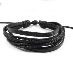 This bracelets consist of several layers of rope and leather and will match any outfit. Stack this bracelet with other bracelets for a stylish look. Adjustable, will fit arms of many different sizes. Simply pull the cords to make the bracelet smaller, and the sides to expand the bracelet. Bracelet Circumference: minimum 6.5 inches, expanded 13 inches. Material: Leather, Rope Cord. Trendy Adjustable Braided Jewelry, Black Braided Casual Friendship Bracelets, Casual Adjustable Bracelet With Black Band, Casual Adjustable Black Band Bracelet, Adjustable Trendy Leather Bracelet, Trendy Adjustable Leather Bracelet, Casual Adjustable Braided Bracelet With Black Band, Trendy Adjustable Braided Bracelet, Trendy Braided Bracelet With Adjustable Cord