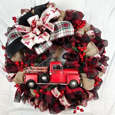 a wreath with a red truck on it