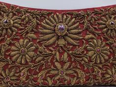 "Add instant glamour and elegance to any evening ensemble with this stunningly beautiful rich burgundy red silk evening bag clutch, intricately hand embroidered by zardozi artisans with copper metallic flowers and embellished with genuine star rubies to create an opulent, sophisticated 3D effect. Such rare artistry and craftsmanship! This is an exclusive piece, a wardrobe investment piece, a modern heirloom. More than fashion, it is an object d'art, inspired by the legacy of royalty. Zardozi mea Designer Hand Embellished Gold Clutch, Designer Festive Gold Clutch, Designer Gold Hand Embellished Clutch, Designer Gold Clutch For Festive Occasions, Gold Evening Bag With Handwork For Reception, Luxury Gold Evening Bag With Handwork, Festive Gold Hand Embellished Clutch, Designer Gold Evening Bag For Festive Season, Festive Gold Designer Evening Bag