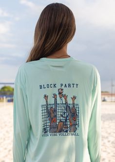 the back of a woman's shirt that says block party on her volleyball team