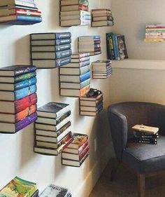 a chair sitting next to a wall filled with books