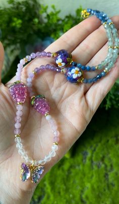 This stunning Choker features Blue Kyanite, Apatite, Amethyst, Mauve Lepidolite, Madagascar Rose Quartz, Clear Quartz, Lampwork glass Berry beads, Gold filled Brass spacers + a Gold filled color shifting glass Butterfly charm. Choker is 17.25 inches. Created + packed with love + intention! 💫 Necklaces come with shipping insurance to ensure they arrive safely! 💕 Multicolor Amethyst Beaded Necklaces As Gifts, Crystal Necklace With Czech Glass Faceted Beads Gift, Faceted Czech Glass Beaded Necklaces As Gift, Czech Glass Faceted Crystal Necklaces For Gifts, Gift Crystal Necklaces With Faceted Czech Glass Beads, Gift Crystal Necklace With Czech Glass Faceted Beads, Czech Glass Crystal Necklace With Faceted Beads Gift, Glass Crystal Necklaces With Round Beads For Gifts, Dainty Chain Necklace