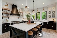 a large kitchen with an island and lots of counter space