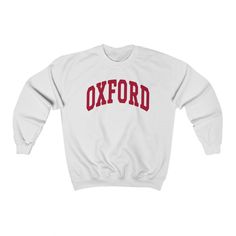 "\"Oxford\" College Style Crewneck Sweatshirt --- - This soft sweatshirt has a loose fit for a comfortable feel - Durable print - Loose fit - 50% Cotton; 50% Polyester (fibre content may vary for different colors) - Runs true to size --- Thanks for visiting our store! --- Shipped from our partner in the US --- You can find even more sweatshirts here: https://www.etsy.com/shop/lukassfr" Collegiate Font, Alabama Sweatshirt, Aggie Pride, Kyle Field, Tuscaloosa Alabama, College Crewneck, Student Center, East Lansing, Alabama State