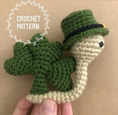 a crocheted broccoli with a hat on it