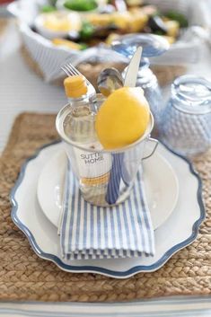 a table set with plates, cups and utensils