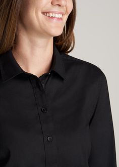 About Our Women's Tall Button-Up Dress Shirt A tall women's shirt that is perfect for days at the office or casual weeknight plans. Made from a blend of cotton, nylon, and spandex, this button-up dress shirt has a slim fit that always flatters. Offering a low-maintenance look, our button-up dress shirt for tall women can be tucked in or out, unbuttoned or buttoned – the choice is yours. Our women's tall shirts are designed specifically for those who are 5'9 - 6'6 and looking for a versatile, wea Classic Button-up Dress Shirt With Covered Buttons, Slim Fit Button-up Dress Shirt For Daywear, Black Button-up Shirt With Concealed Placket, Black Cotton Button-up Dress Shirt, Black Slim Fit Button-up Dress Shirt, Shirt Dress Outfit, Button Up Dress, Black Button, American Shirts