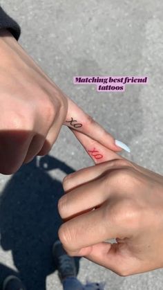 two hands holding each other with tattoos on their fingers and the words matching best friend tattoos