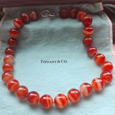 Tiffany & Co Carnelian Bead Necklace. Sterling Silver. 16mm Beads. 19.5 Inches End To End. In Amazing Condition. No Chips, Cracks Or Blemishes Of Any Kind To The Gemstones. The Cord Is Tight With No Fraying. Hallmarks As Pictured In The Inner Rim Of The Clasp. Comes With Large Tiffany Pouch. This Item Is Crosslisted Ebae- Hulutv Elegant Red Natural Gemstones, Elegant Red Gemstone Beads And Cabochons, Luxury Red Necklace With Polished Beads, Polished Beads For Formal Gems And Cabochons, Jewelry Tiffany, Carnelian Beads, Tiffany Co Jewelry, Necklace Sterling Silver, Bead Necklace