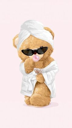 a brown teddy bear wearing sunglasses and a white towel on its head, with a cupcake in his hand