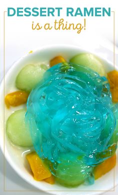 a white bowl filled with blue and green jello