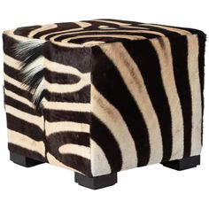 a zebra print stool with black legs